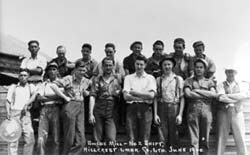 Group of men posing including Chinese workers